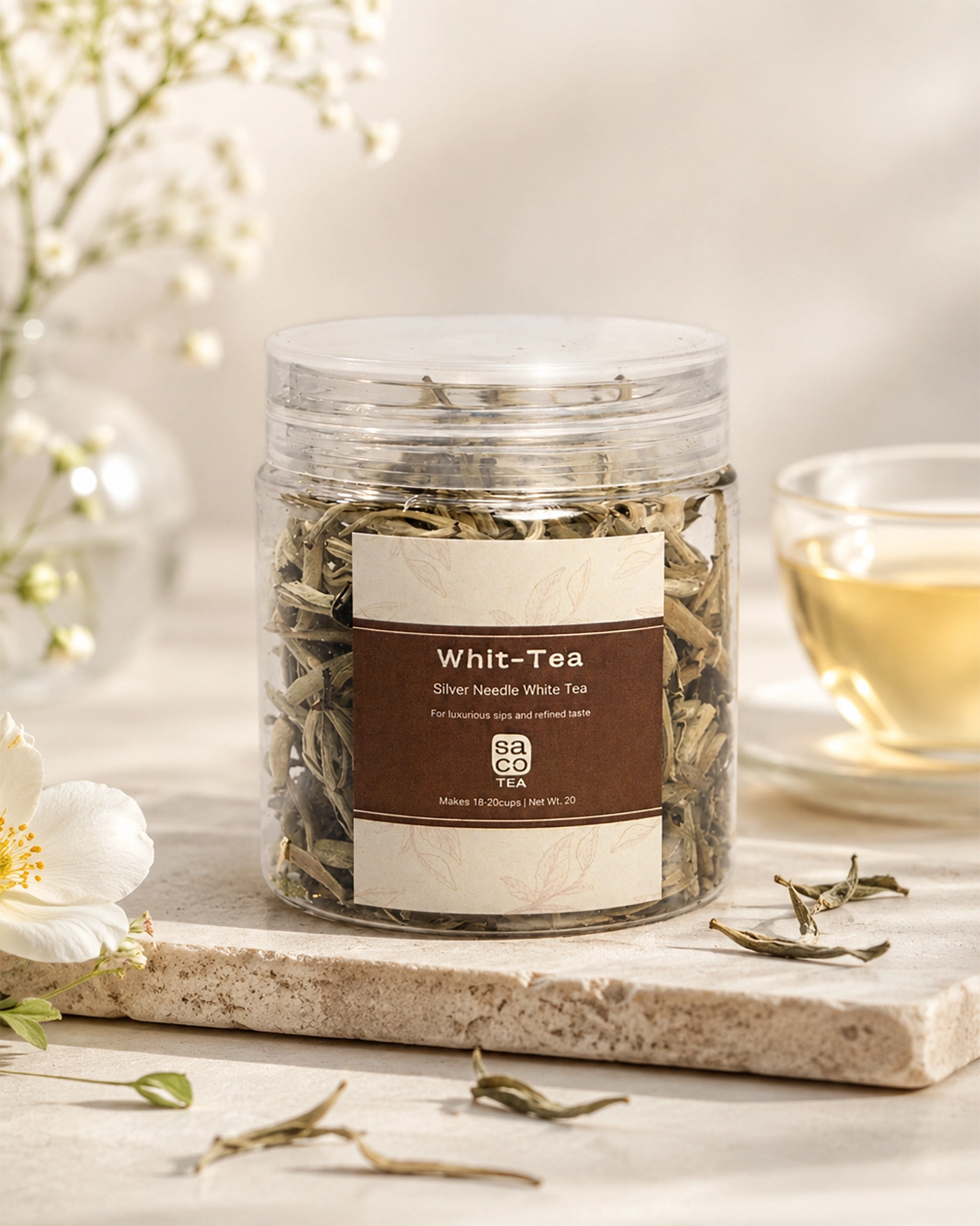 Jar of Whit-Tea with a glass of tea in the background on a light surface.