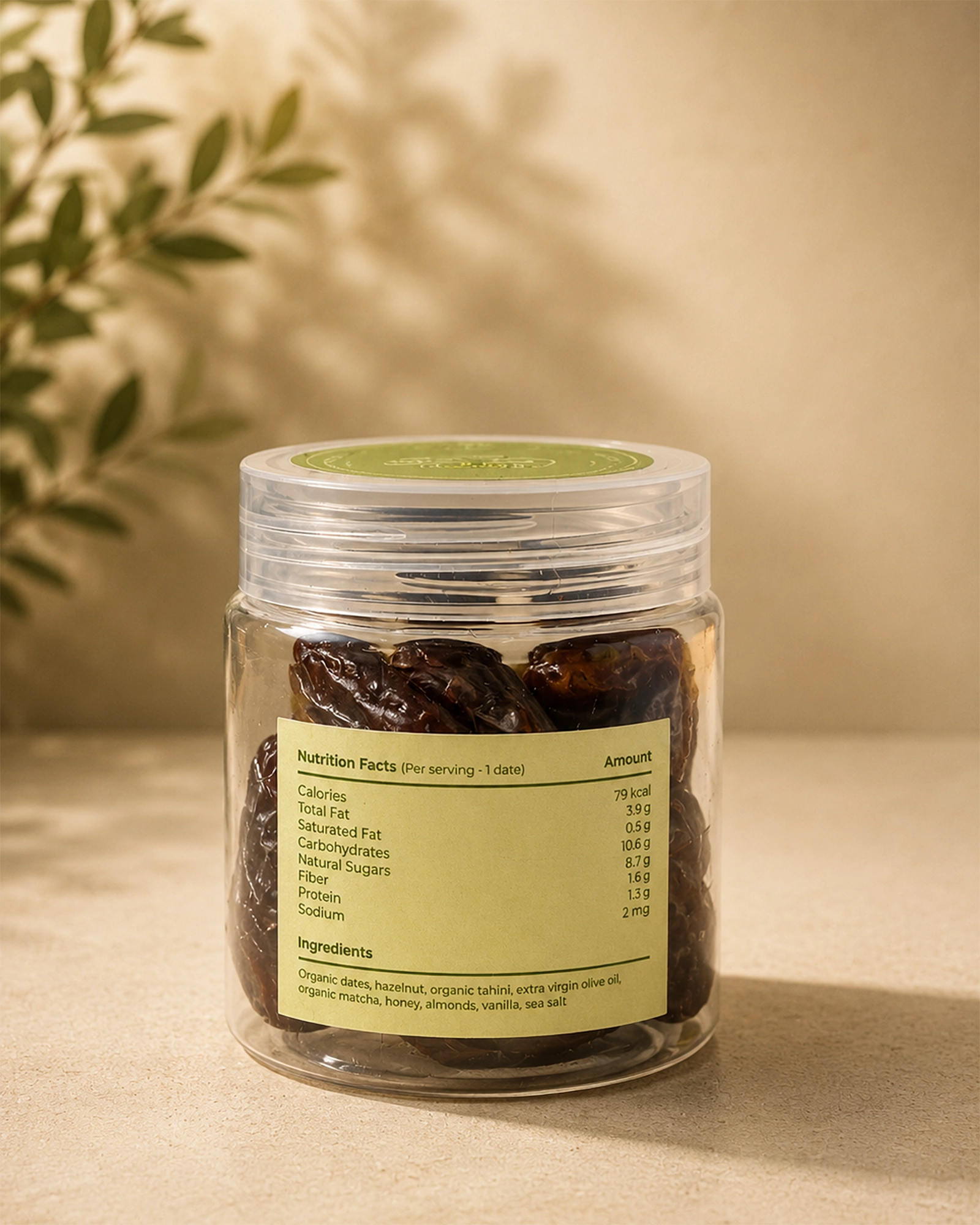 Back view of Saco Tea Green Heart Dates jar showing the nutrition facts label on a beige surface.