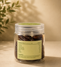 Back view of Saco Tea Green Heart Dates jar showing the nutrition facts label on a beige surface.