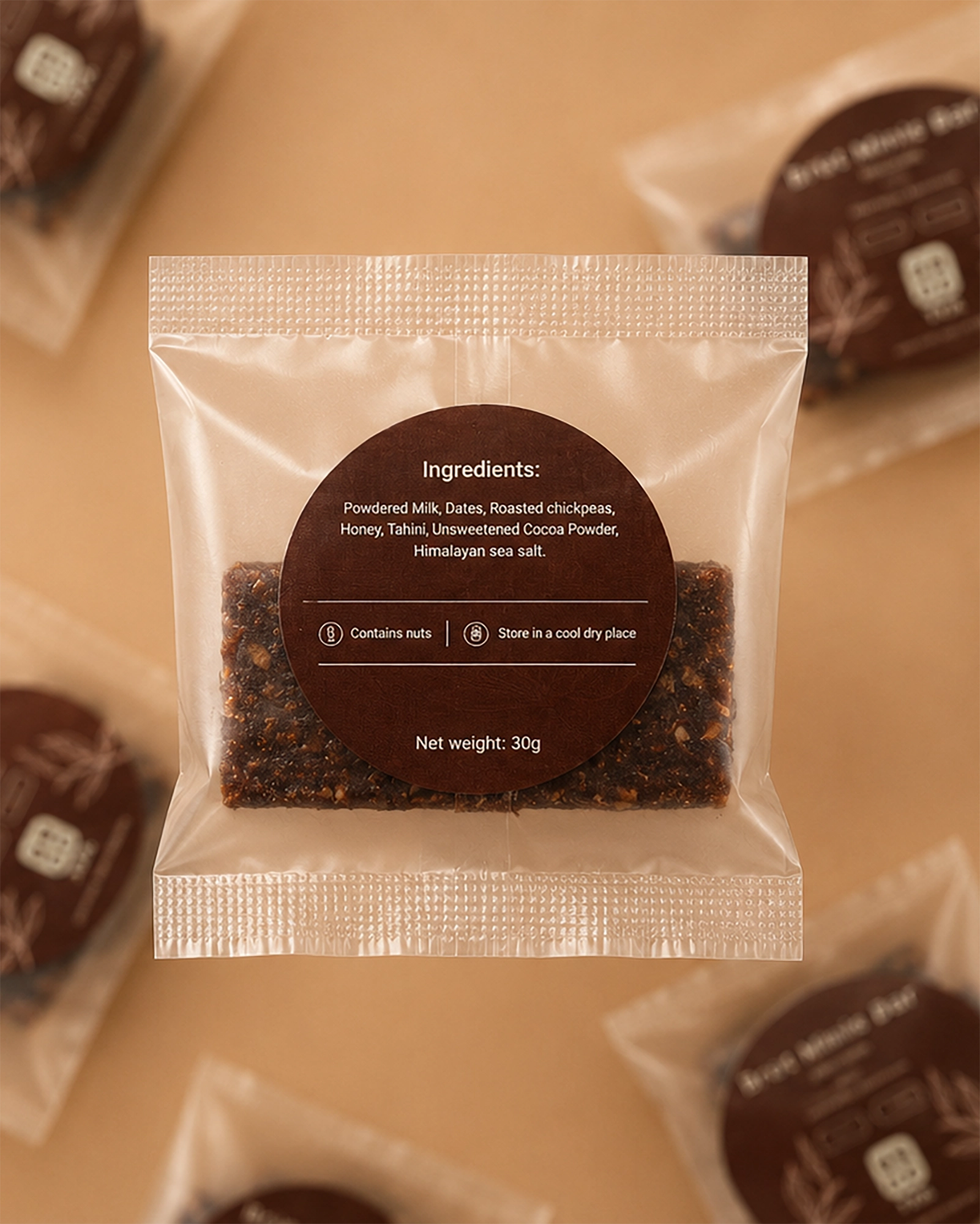 Back view of packaged Brüt Minis Bar chocolate showing the ingredients label on a beige background.