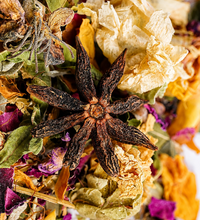 Close-up of dried flowers and herbs with star anise for Saco Tea Signature Tea.