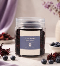 Jar of Fruito-Tea with blueberries and hibiscus on a table